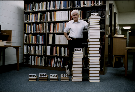 Helmut A. Abt, then Editor-in-Chief of The Astrophysical Journal (ApJ), is standing next to stacks of that leading professional publication. (courtesy NOAO).